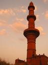 The bright orange Tower of Victory at Daulatabad Fort.